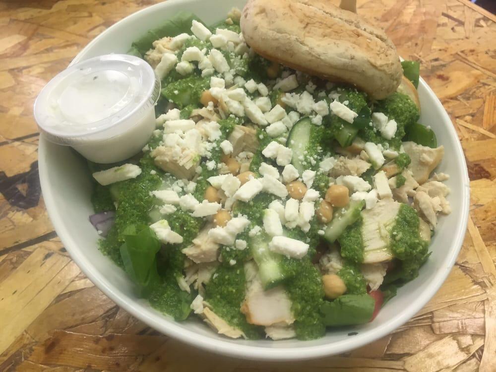 Pesto Chicken Salad · Grilled chicken breast, spinach, chick peas, basil pesto, red onions, tomatoes, feta and cucumbers. Served with Greek yogurt ranch dressing.