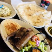 Gyro Plate · Lean ground beef and lamb, roasted on a vertical pit and thinly sliced. Served with hummus, ...