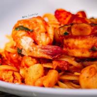 Lobster Diavolo · Pasta tossed with lobster meat, shrimp, scallops, and mushrooms in a spicy tomato cream sauce.