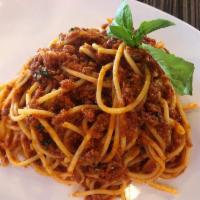 Spaghetti Bolognese · Spaghetti pasta tossed in our homemade meat sauce with fresh herbs.