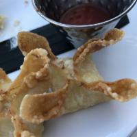 Crab Rangoon · Imitation crab mixed with cream cheese and green onions served with sweet and sour sauce.