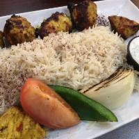 Chicken Kabob · Cubed of chicken breast marinated and skewered with vegetables, served over rice and yogurt ...