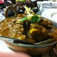 Goat Karahi · Tender goat meat cooked with ginger, garlic, tomato, and onion base gravy in Mumbai grill ho...