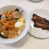 Shoyu Chicken Ramen · Soy based chicken broth, egg noodles, chashu pork, market fresh vegetables, onsen tamago, an...