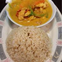 Yellow Curry · Thai yellow curry with coconut milk, bell pepper, carrots, tomato, and potato served with st...