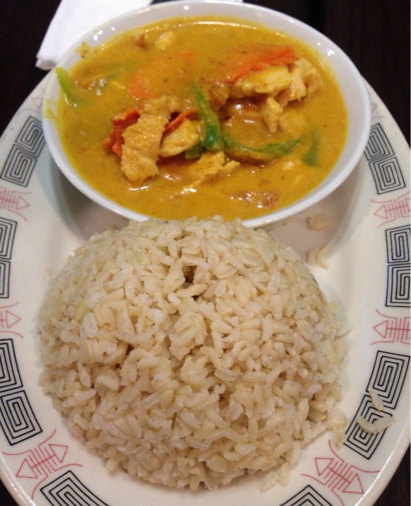 Yellow Curry · Thai yellow curry with coconut milk, bell pepper, carrots, tomato, and potato served with steamed rice.