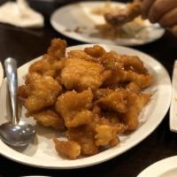 Orange Chicken · Deep-fried chicken mixed with orange sauce.