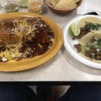 Asada Burrito · Charbroiled ranchera (flap steak), beans and rice inside a large flour tortilla.