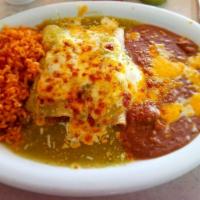 Enchiladas Suizas · Two tortillas dipped in tangy tomatillo green sauce and stuffed with chicken, rolled and top...