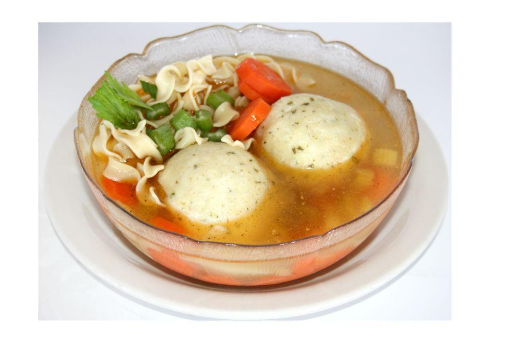 Matzo Ball Soup · Chicken soup with noodles, veggies, and a matzo ball.