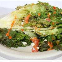 Grilled Romaine Salad · Grilled romaine served with tomatoes, fresh feta cheese, and a dash of salt, drizzled with o...