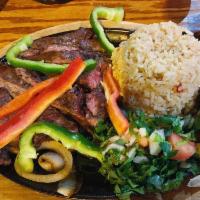 Fajitas · Sizzling strips of charbroiled chicken or steak with onions, and peppers. Served with guacam...