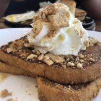 Cinnamon Toast Crunch · Cinnamon toast crunch-coated French toast layered with cream cheese frosting, cinnamon /brow...