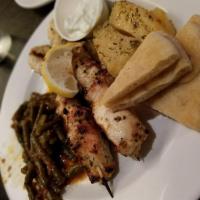 Chicken Souvlaki · Medallions of chicken, seasoned with olive oil and our special blend of Greek spices, skewer...
