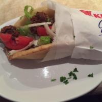 Falafel Pita Sandwich · Seasoned vegetarian patties, made with garbanzo bean, lightly fried and topped with onions, ...