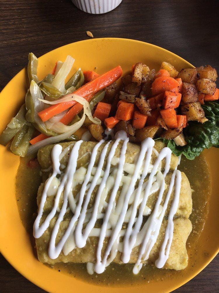 3 Enchiladas Verdes · Three fried corn tortillas filled with chicken topped with tomatillo sauce, cheese, sour cream and red onion, served with potato, carrot, chorizo veggies and escabeche.