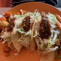 3 Tacos Dorados · Three crispy tacos filled with choice of potatoes, chicken or carnitas with lettuce. Served ...