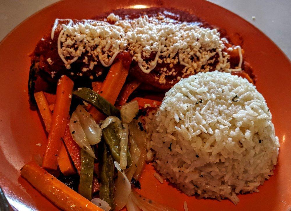 Chile Relleno · Chile poblano stuffed with queso fresco topped with home made tomato sauce. Served with house rice and escabeche, tortillas on request.