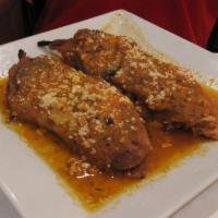 Chiles Rellenos · Roasted poblano peppers dipped in egg butter, pan fried and stuffed with your choice of fill...