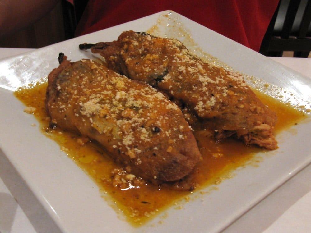 Chiles Rellenos · Roasted poblano peppers dipped in egg butter, pan fried and stuffed with your choice of filling.
