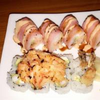 Volcano Roll · Shrimp tempura roll, topped with special oven baked scallop mixed with crab, cream cheese, a...