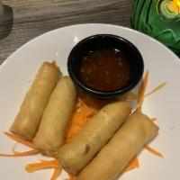Crispy Spring Rolls · Thin crepe wrapped with mixed cabbage, carrots.
