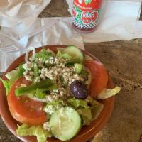 Greek Salad · Fresh lettuce, tomatoes, cucumbers, onions, bell peppers, kalamata olives, feta cheese and t...