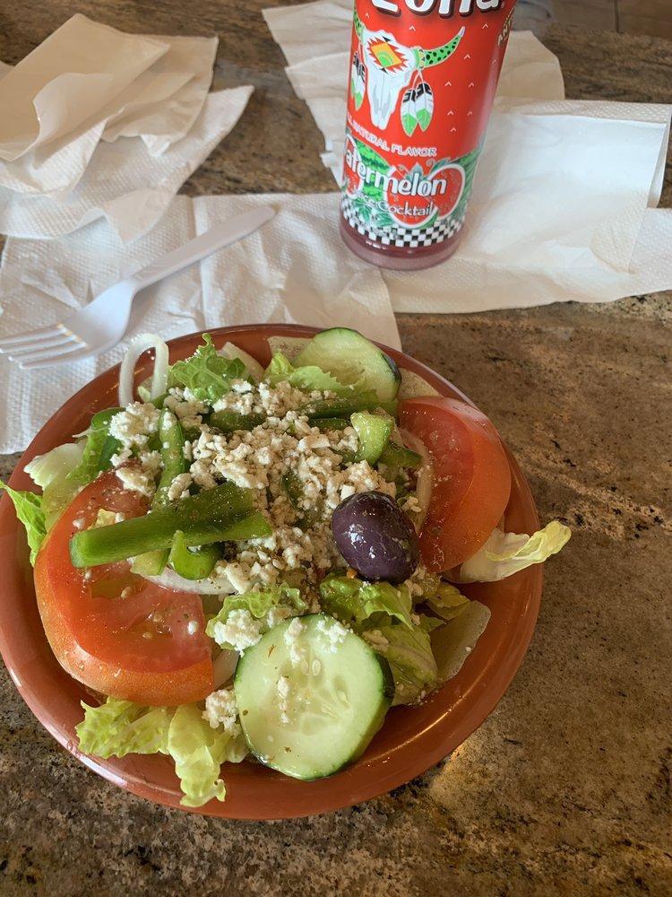 Greek Salad · Fresh lettuce, tomatoes, cucumbers, onions, bell peppers, kalamata olives, feta cheese and topped with Greek vinaigrette.