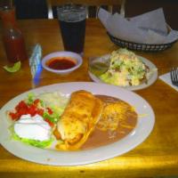 Chimichanga · Your choice of our premium chicken or beef wrapped in a soft tortilla then fried and topped ...