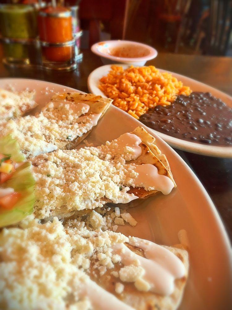 Quesadillas · Tortillas stuffed with cheese, topped with crema and fresh cheese and pico de gallo.