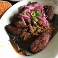 Cochinita Pibil · slow cooked Yucatan style achiote pulled pork with pickled habanero red onions and sweet pla...