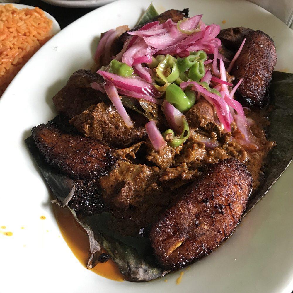 Cochinita Pibil · slow cooked Yucatan style achiote pulled pork with pickled habanero red onions and sweet plantains