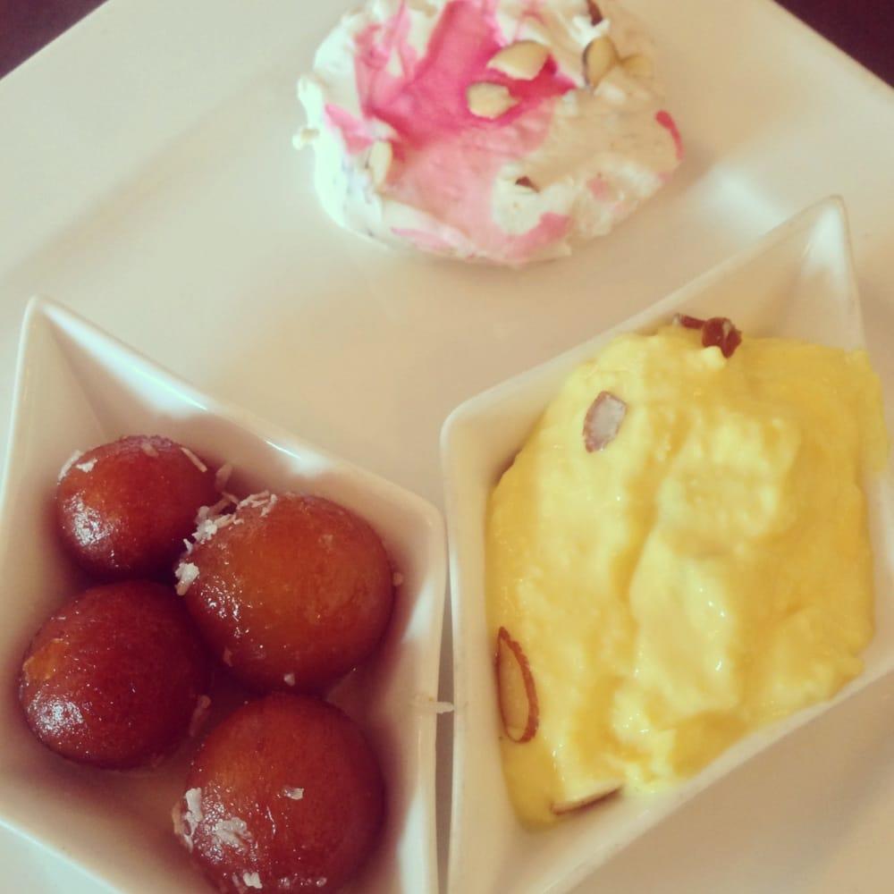 Gulab Jamun · A light pastry ball made with milk and honey in a thick syrup.