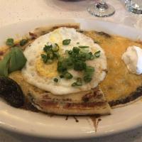 Huevos Rancheros · Black beans, ranchero sauce, sour cream, green onions & Tillamook cheddar cheese on top of t...