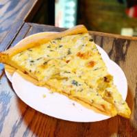 Artichoke Pizza · Artichoke hearts, spinach, cream sauce, mozzarella and pecorino Romano cheese.