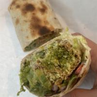 Falafel Wrap · Comes with tahini sauce, and the works lettuce, tomato, red onions, pickles, jalapenos, spro...