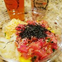 Ahi Tuna Bowl · Sushi rice, tuna with onion, scallion, lettuce, kale, red radish, and seaweed salad topped w...