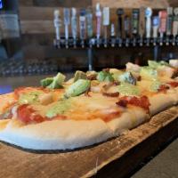 Flatbread · Comes with chicken, tomatoes, bacon, mozzarella and drizzled with cilantro ranch.