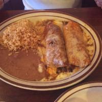 Kids Cheese Enchilada · Served with Spanish rice and refried beans.