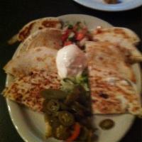Beef Fajita Quesadillas · Made with Roasted Bell Peppers, sauteed Onions and Pepperjack cheese. Served with side of So...