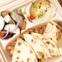 Chicken Shawarma with Garlic Sauce Plate · Served with Greek salad, hummus, and pita bread.