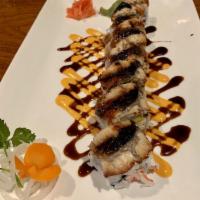 Dragon Roll · California roll with fresh water eel and eel sauce on top. Fully cooked.
