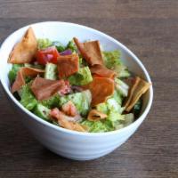 Fattoush Salad · Romaine, tomatoes, cucumbers, onions and pita chips.