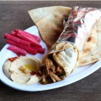 Chicken Shawarma Wrap · Lettuce, cucumber pickles & garlic paste served with pickled turnips & a side pick.