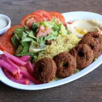 Falafel Plate · Falafels, tomatoes, pickled turnips, tahini sauce served over rice pilaf, side salad & 2 sid...