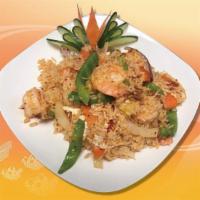 R1. Coconut Fried Rice · Red and green pepper, pineapple, onion and egg stir fried in coconut milk. Hot and spicy.