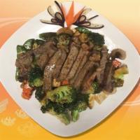 W1. Grilled Steak Asian Style · Tender steak cut in thick slices, perfectly grilled and seasoned and accompanied with mixed ...