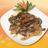 W5. Thai Basil Duck · Duck with bone sauteed with pepper, basil, onion, scallion and chili sauce. Hot and spicy.