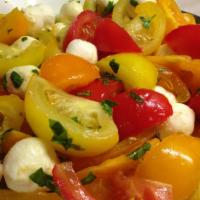 Italian Tomato Salad · All organic! Vine ripe, pesticide free tomatoes with mixed greens, onions, basil, baby mozza...