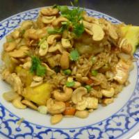 Pineapple Fried Rice · Combination of chicken, shrimp, and diced pineapple, peas, carrots, onions, and topped with ...